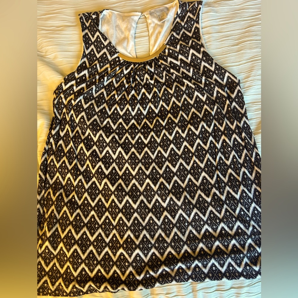 H&M large Gently used black and white top with gold embellishment.